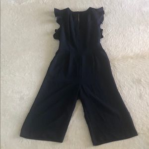 Navy wide leg jumpsuit with ruffle sleeve